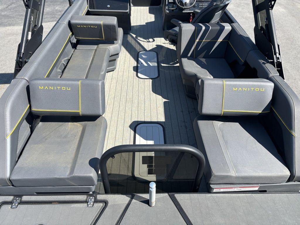 2023 Manitou Explore 22 Max Bench interior with gray seating and yellow accents.