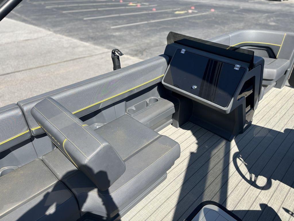 2023 Manitou Explore 22 Max Bench interior with modern seating and control panel.