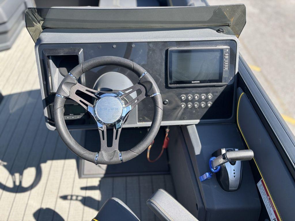 Steering console of 2023 Manitou Explore 22 Max Bench pontoon boat.