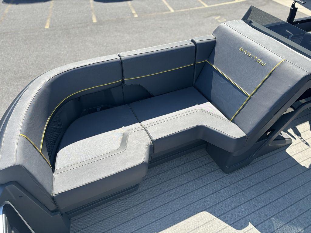 2023 Manitou Explore 22 Max Bench with sleek gray seating and yellow accents.