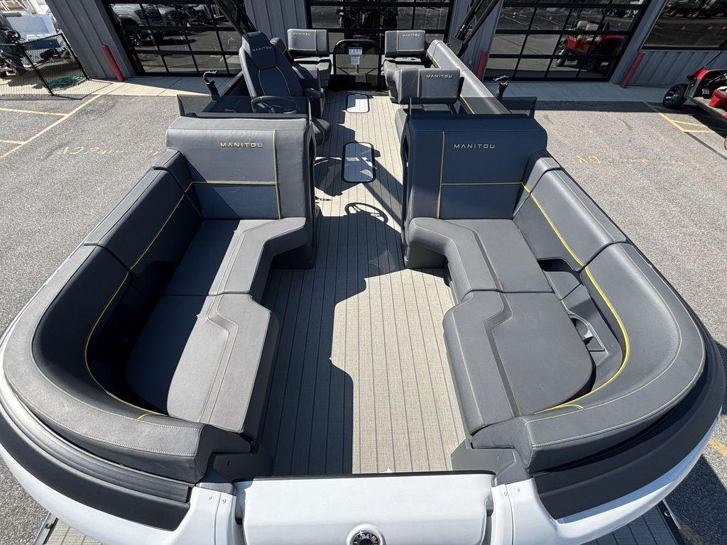 2023 Manitou Explore 22 Max Bench pontoon boat with spacious seating and modern design.