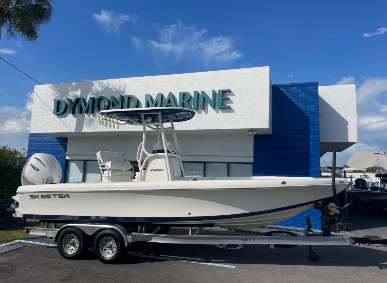 2025 Skeeter SX 2350 boat on trailer outside Dymond Marine dealership.