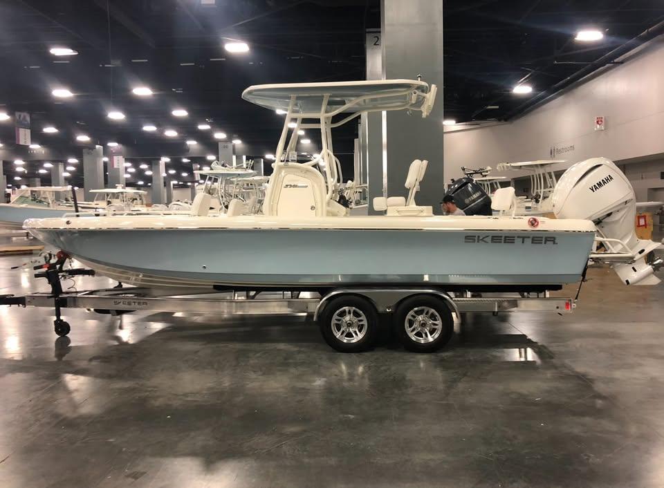 2024 Skeeter SX 2550 Family boat displayed indoors on a trailer.