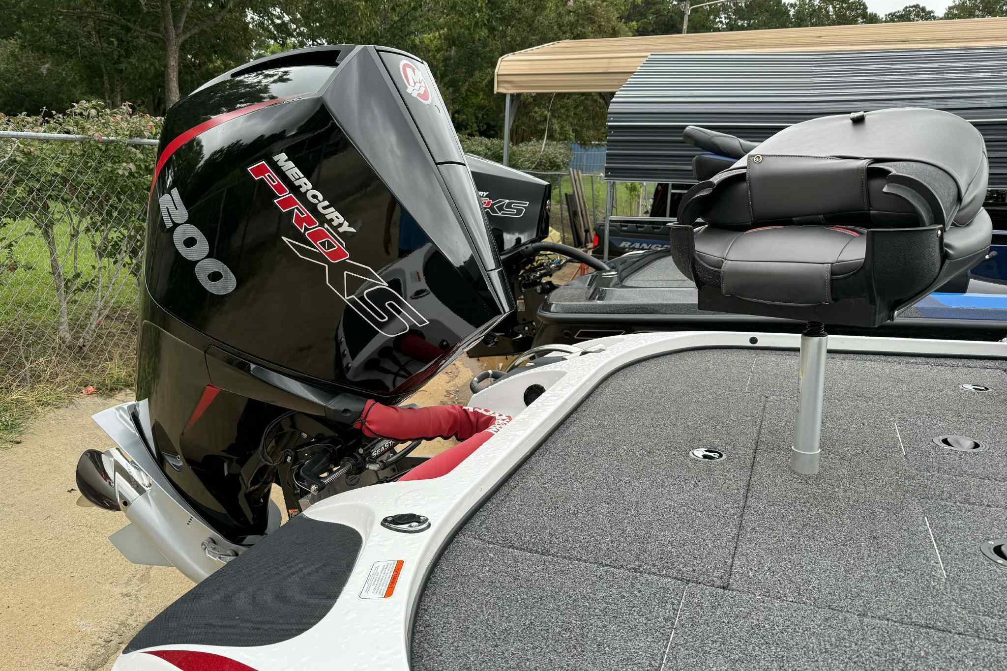 2019 Nitro Z19 Pro boat with Mercury Pro XS 200 engine and cushioned seat.