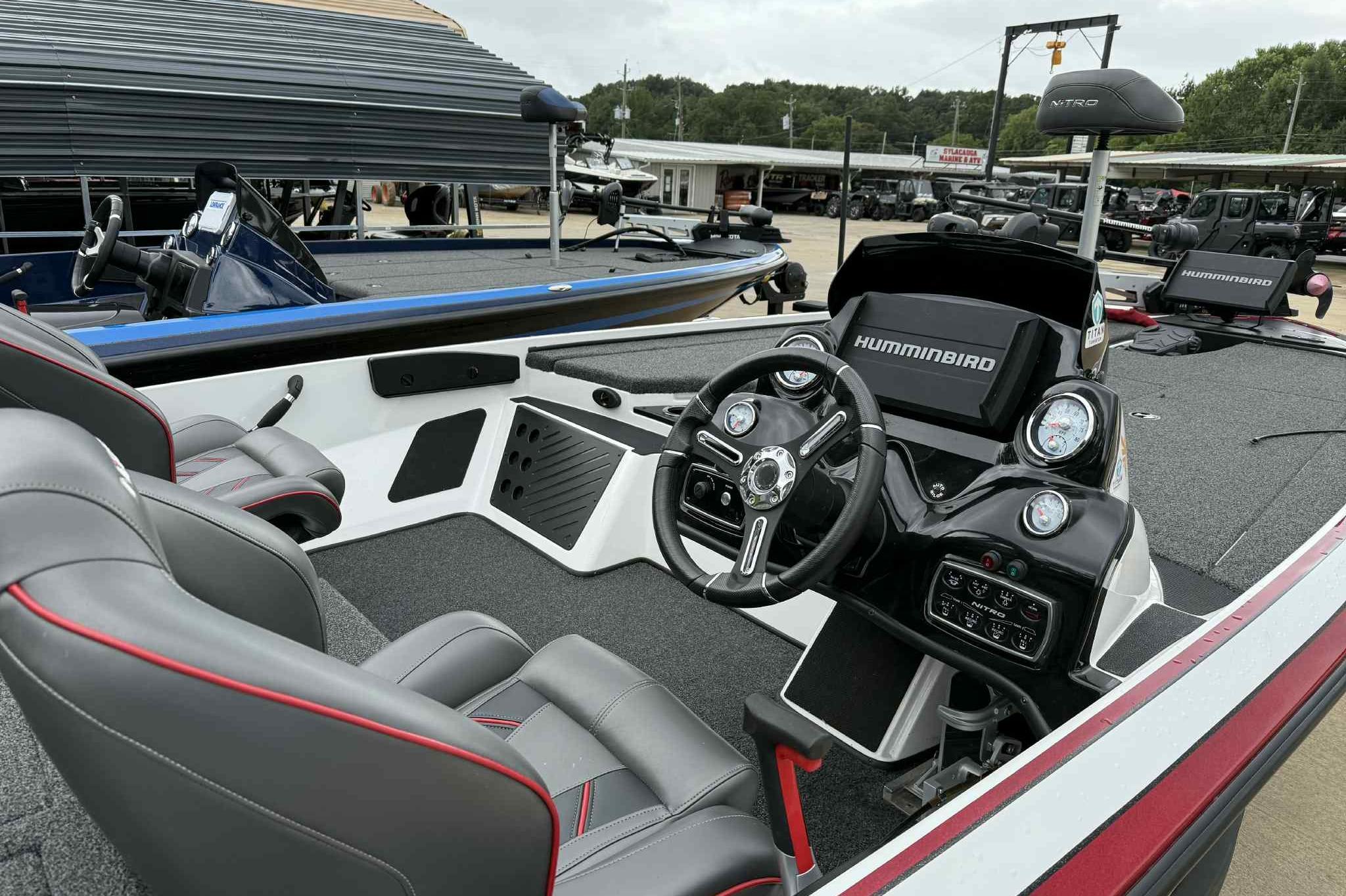 2019 Nitro Z19 Pro boat interior with steering wheel and Humminbird electronics.