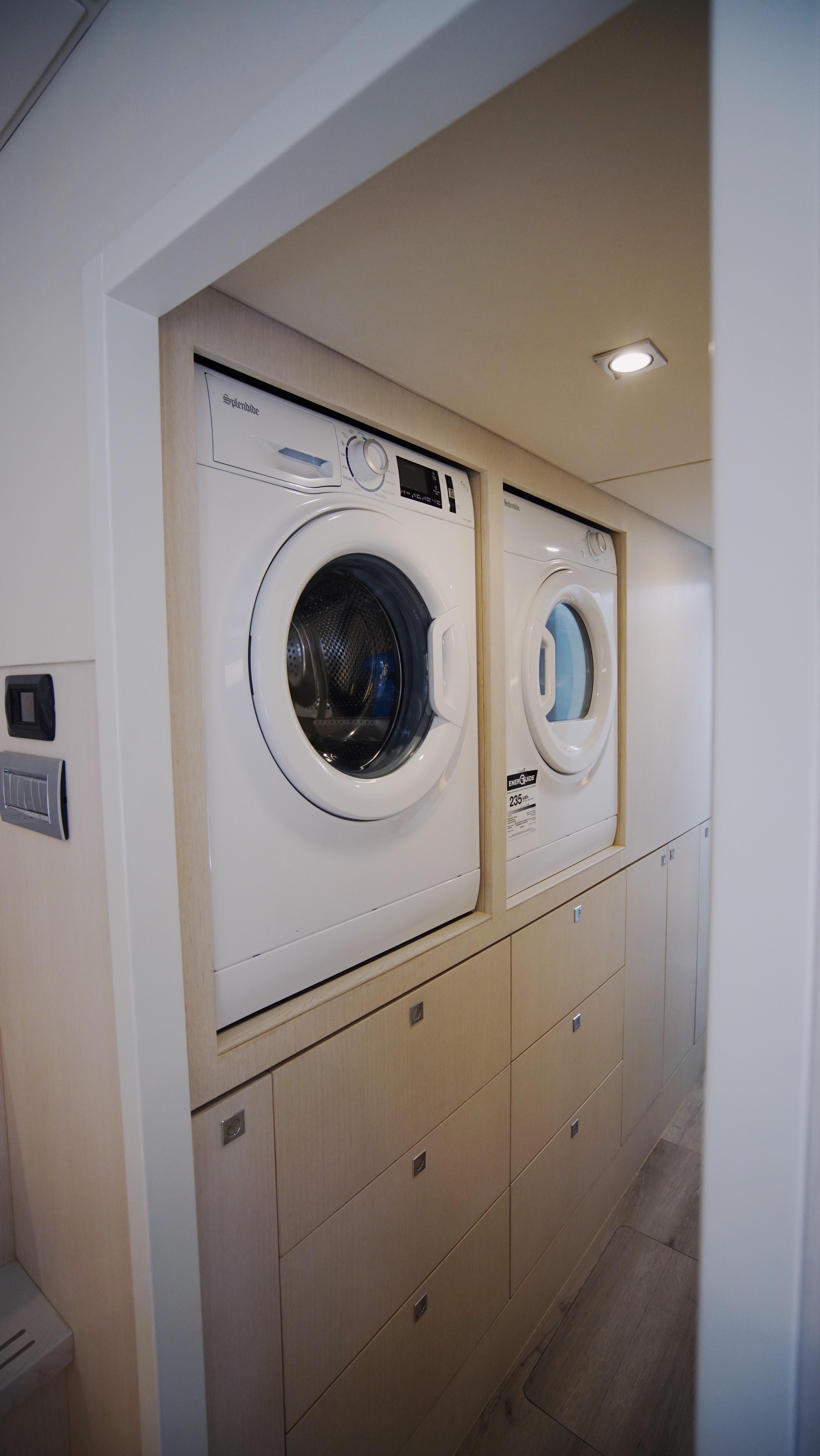 Two Oceans-555  008 2025 -FL-US-Stacked washer and dryer in a compact laundry space, Two Oceans 555  008, 2025 model.-9676126 | Thumbnail