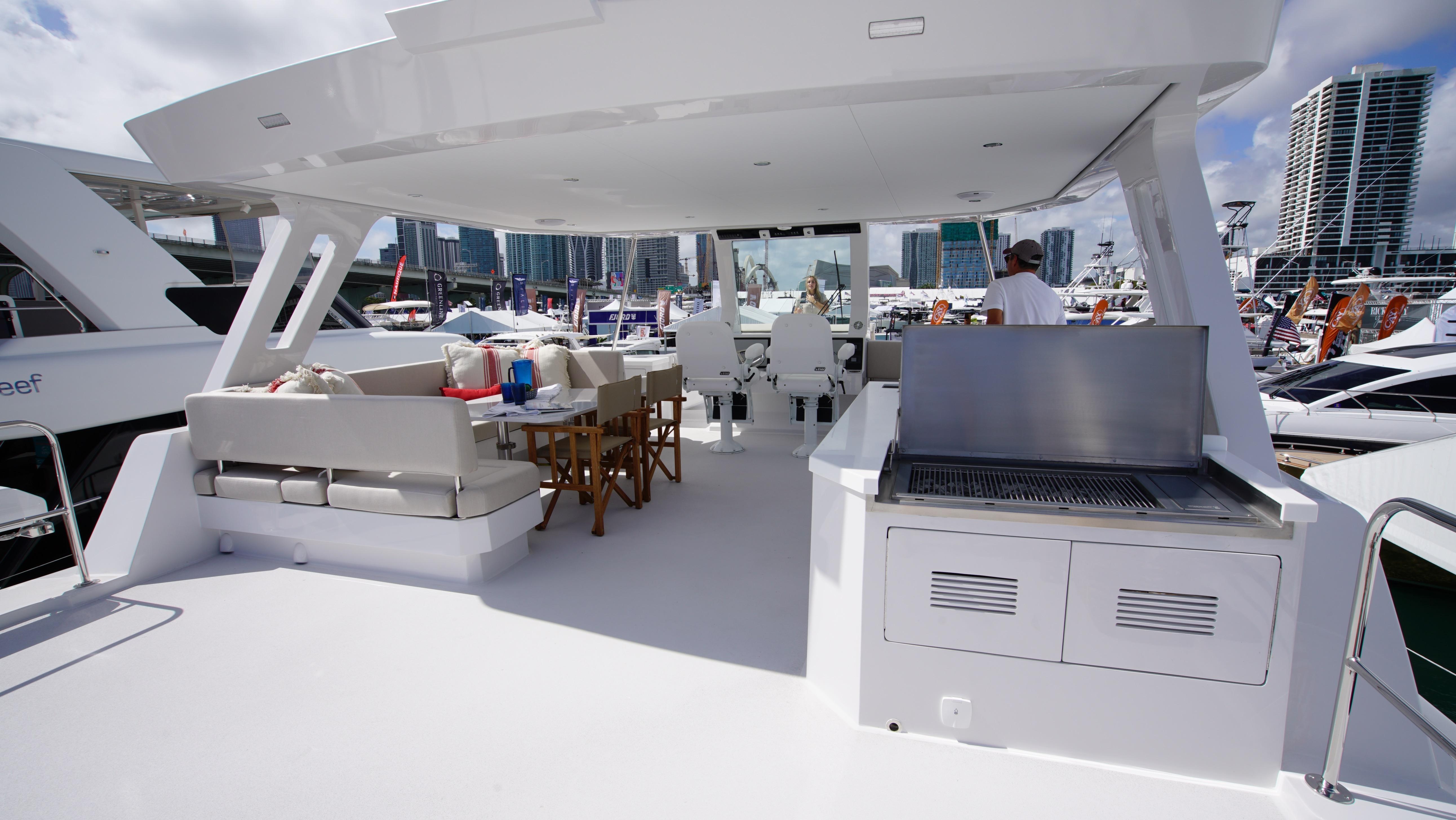 Two Oceans-555  008 2025 -FL-US-Luxurious Two Oceans 555  008 yacht deck with seating and grill, 2025 model.-9676126 | Thumbnail