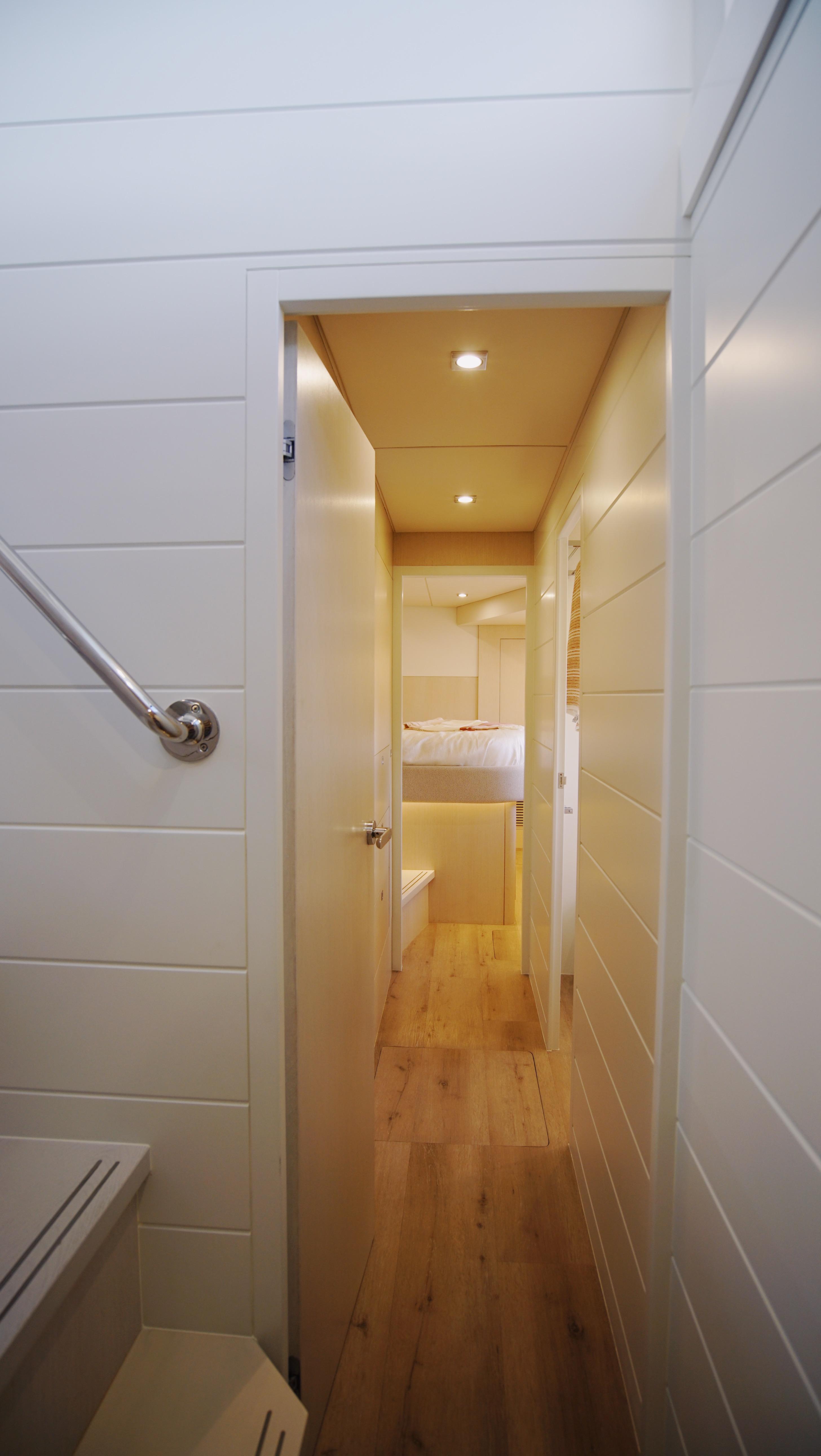 Two Oceans-555  008 2025 -FL-US-Interior hallway of Two Oceans 555  008 yacht, 2025 model, with wooden flooring and modern design.-9676126 | Thumbnail