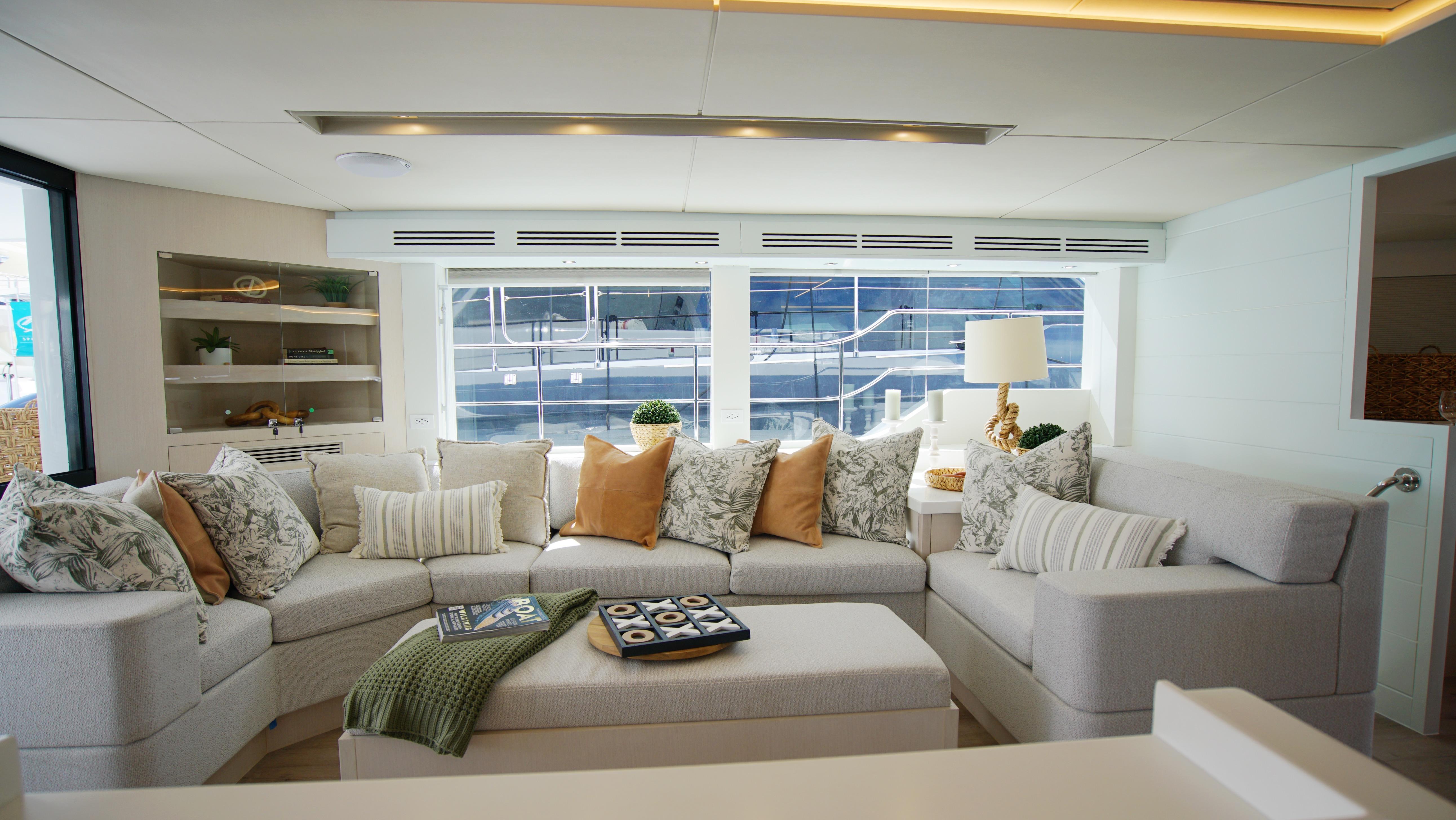 Two Oceans-555  008 2025 -FL-US-Luxurious yacht interior with plush seating, decorative pillows, and modern decor. Two Oceans 555  008, 2025.-9676126 | Thumbnail