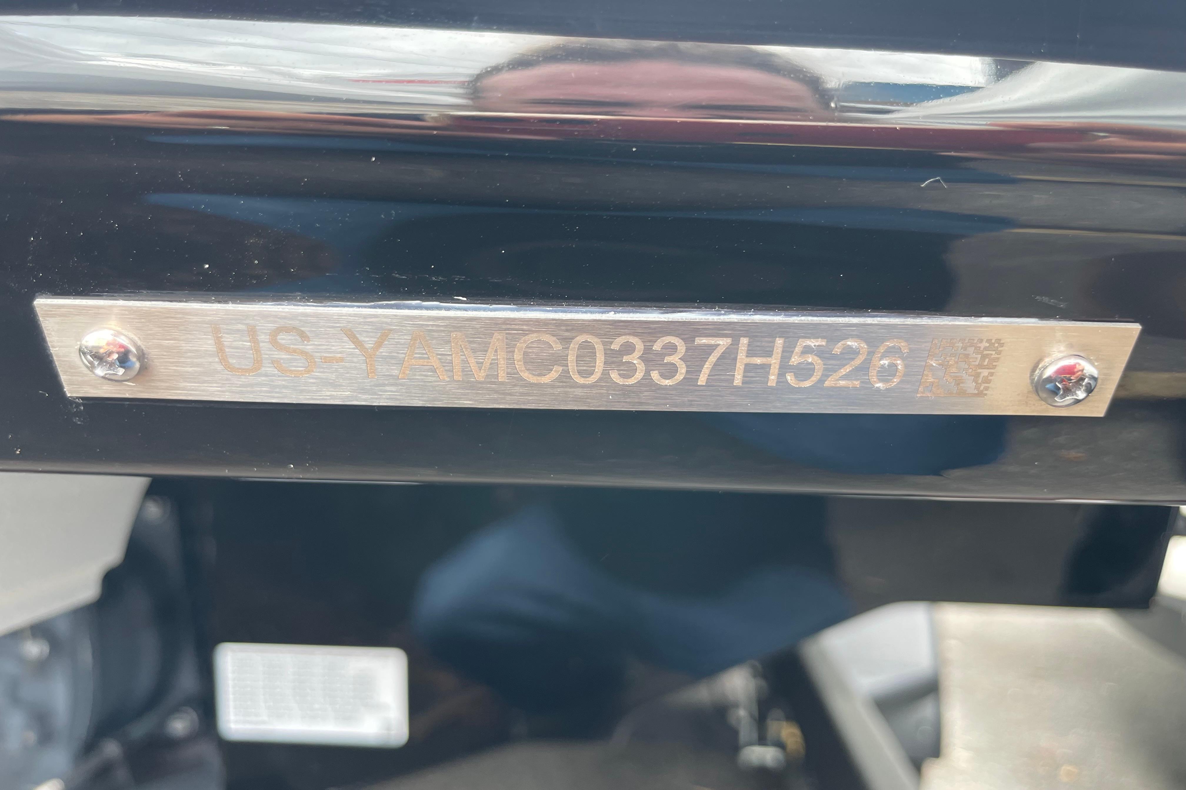 2026 Yamaha AR250 identification plate with serial number, mounted on a black surface.