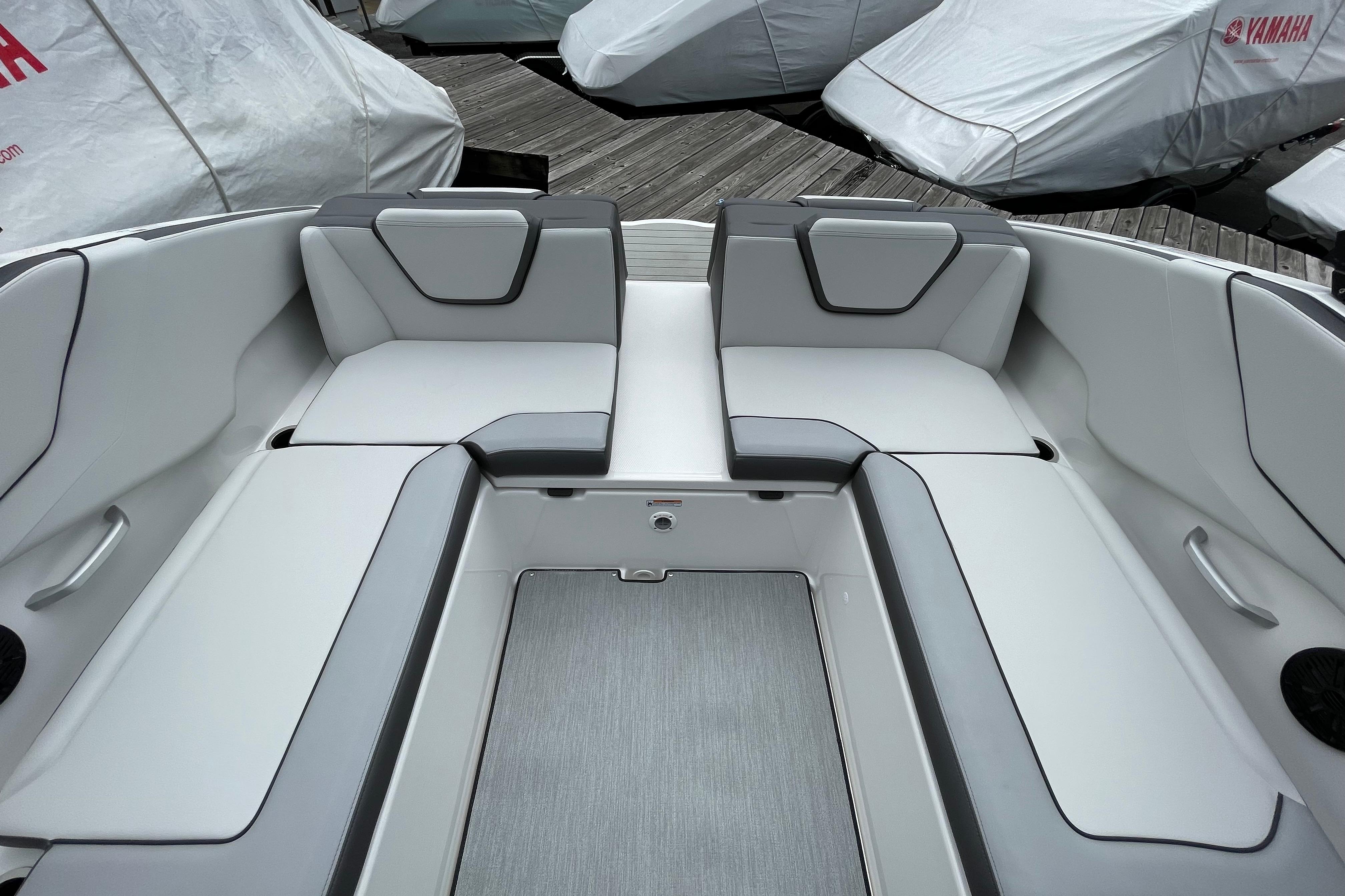 2026 Yamaha AR250 boat interior with sleek, modern seating design.