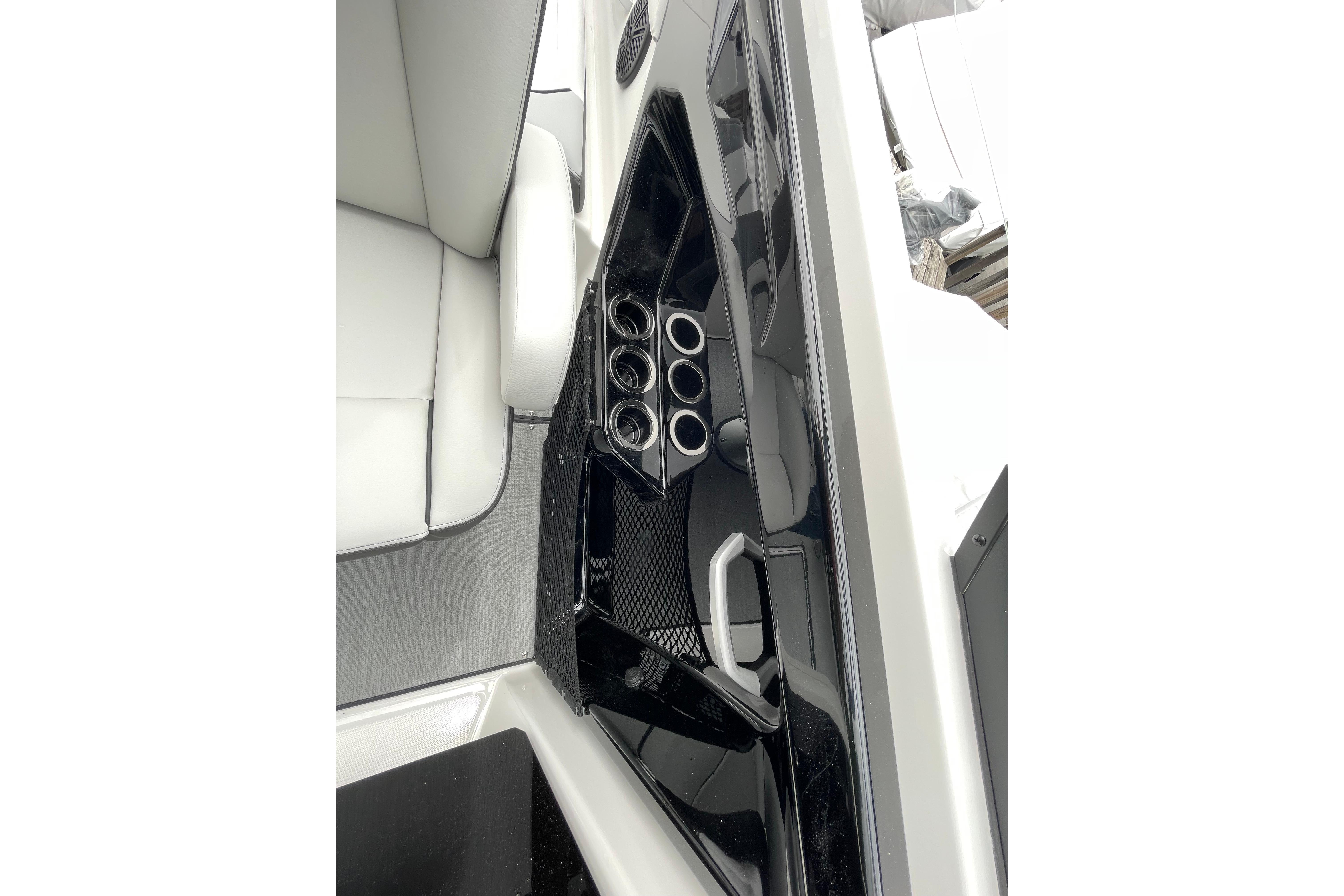 2026 Yamaha AR250 boat interior with cup holders and sleek seating design.