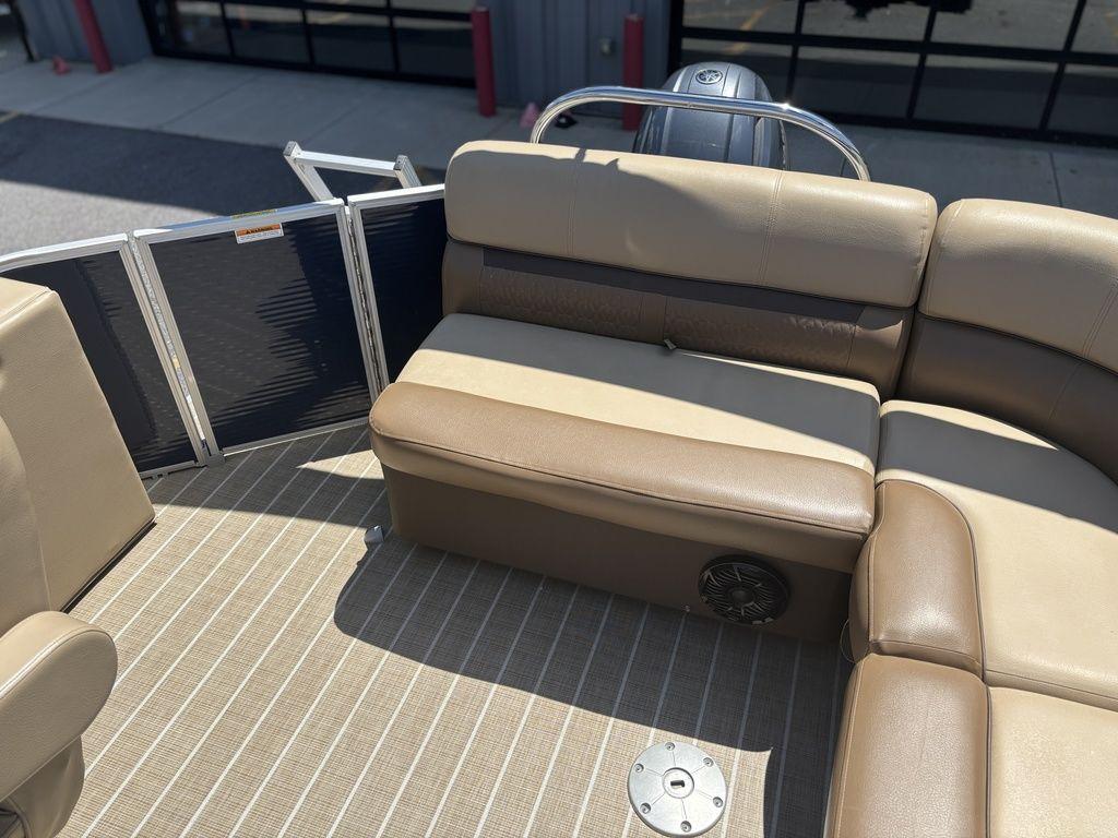 2021 Godfrey SW 2086 C boat interior with beige seating and striped flooring.