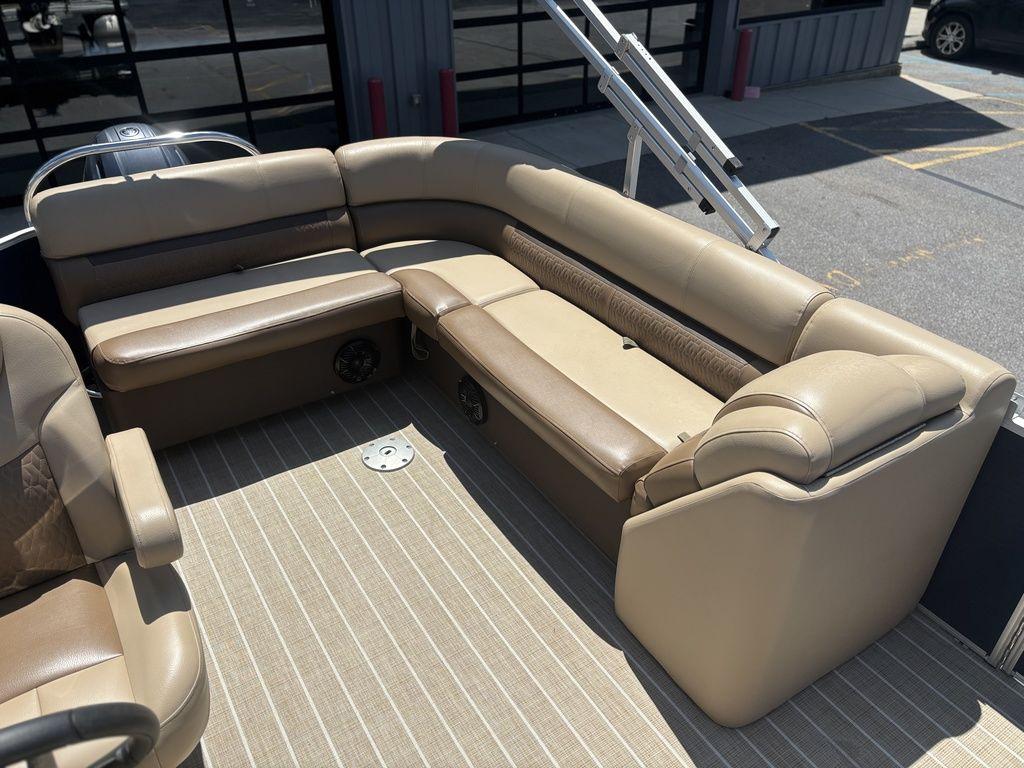 Luxurious seating on 2021 Godfrey SW 2086 C pontoon boat, featuring beige upholstery.