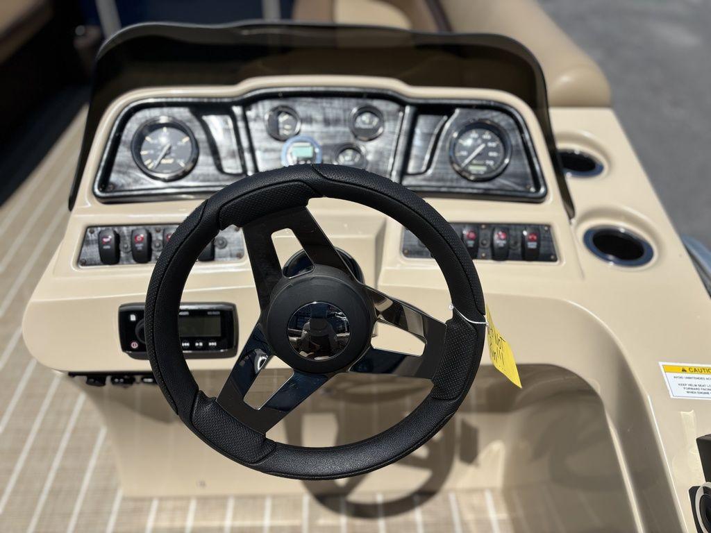 Steering wheel and dashboard of 2021 Godfrey SW 2086 C boat.