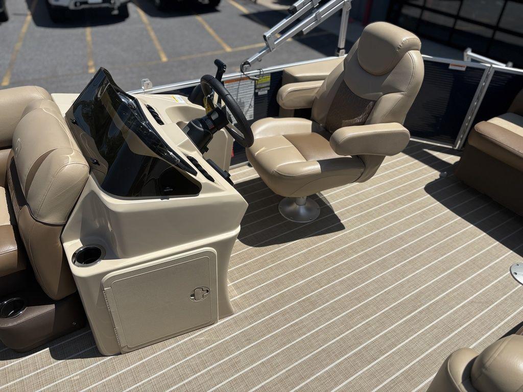 2021 Godfrey SW 2086 C boat interior with beige captain's chair and steering console.