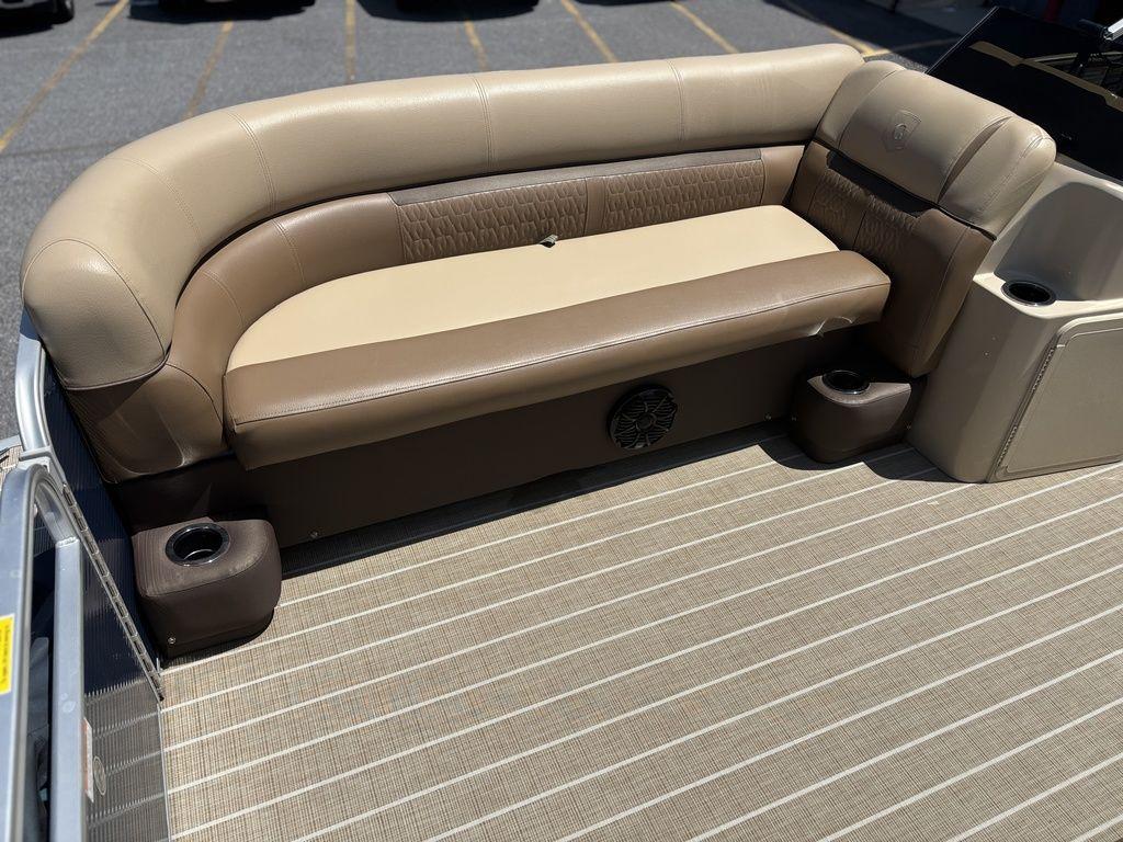 Beige and brown seating on 2021 Godfrey SW 2086 C boat with cup holders.