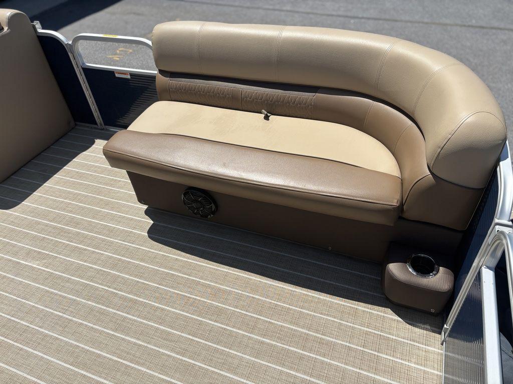 Beige seating on 2021 Godfrey SW 2086 C boat with striped flooring.