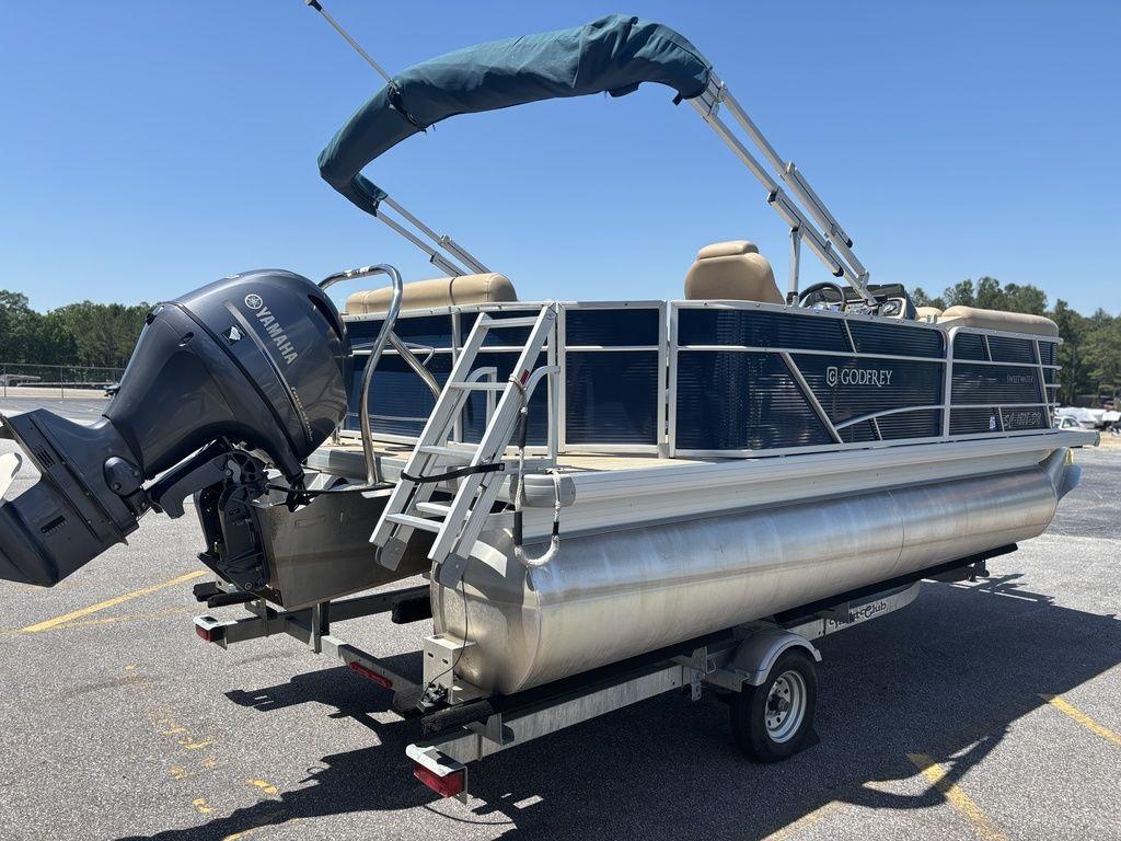 2021 Godfrey SW 2086 C pontoon boat with Yamaha motor on trailer.