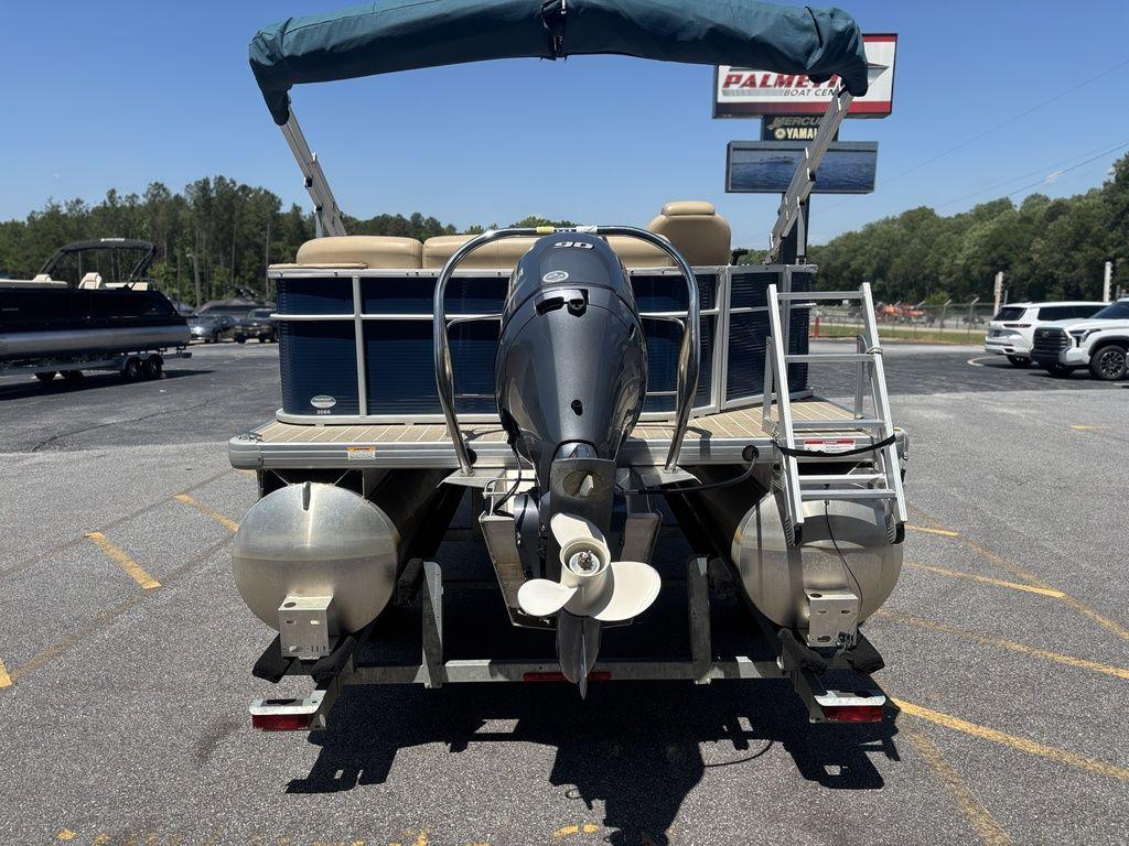 2021 Godfrey SW 2086 C pontoon boat with outboard motor in parking lot.