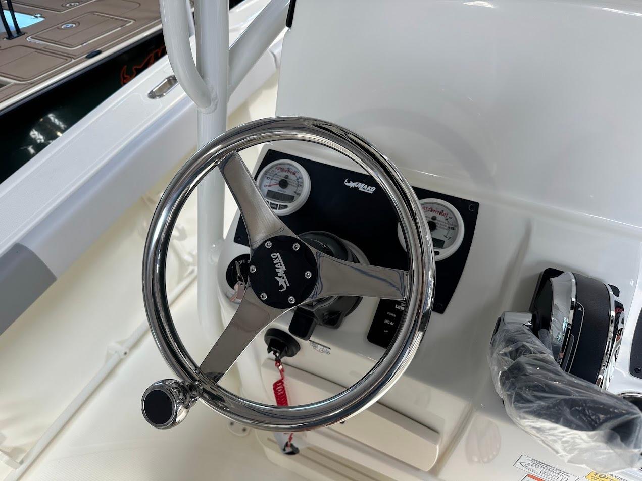 Steering wheel and controls of 2025 Mako 214 CC boat.