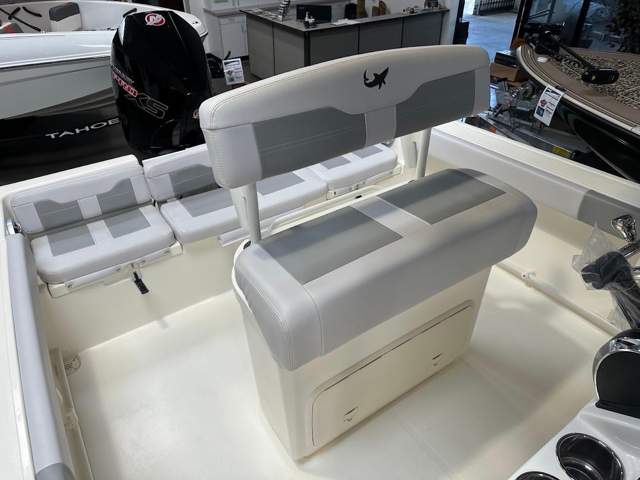 2025 Mako 214 CC boat interior with seating and storage compartments.
