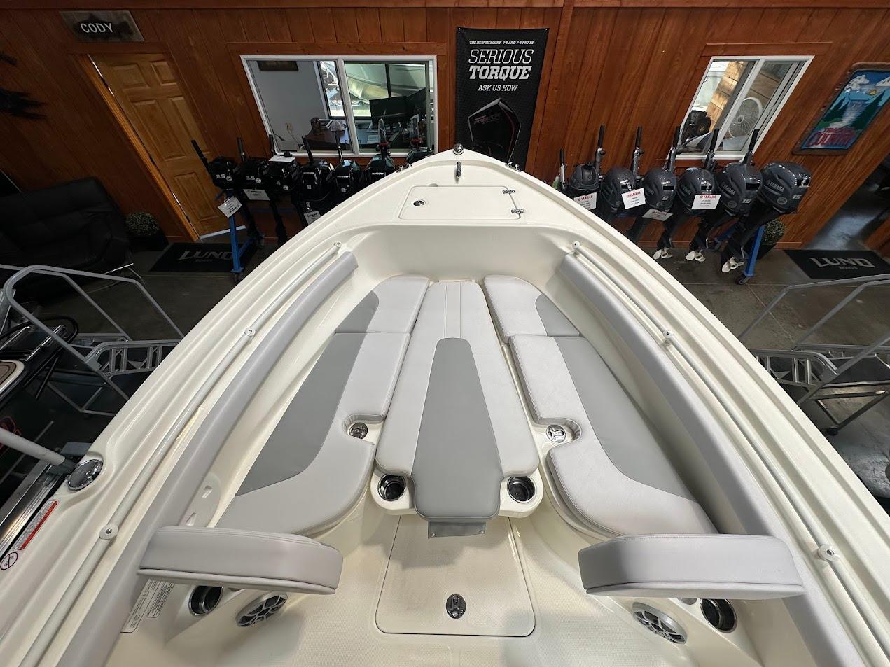 2025 Mako 214 CC boat interior with cushioned seating and modern design.