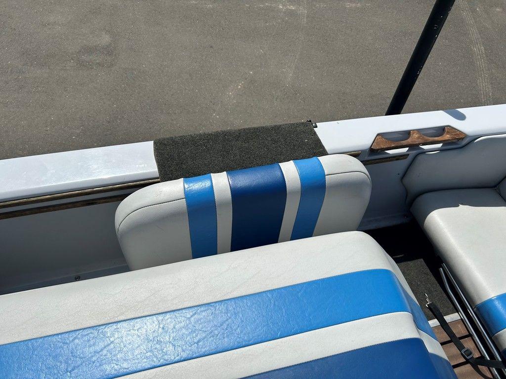 1980 Ski Supreme boat interior with blue and white striped seats.