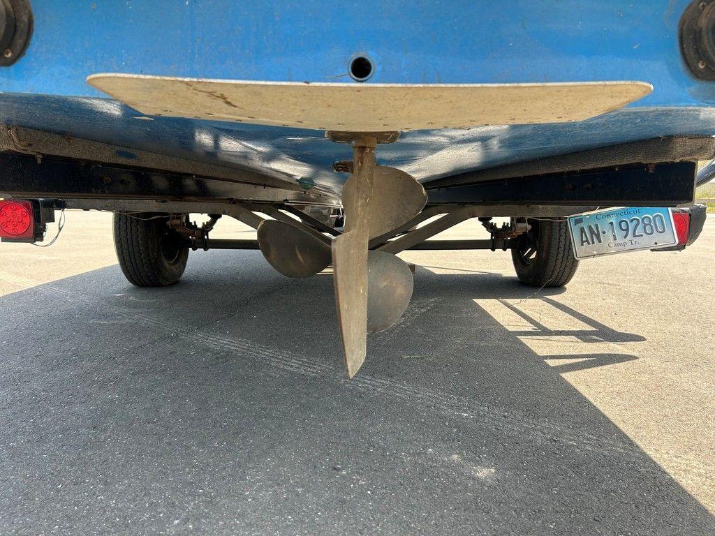 1980 Ski Supreme boat propeller and rudder, rear view, with visible license plate.