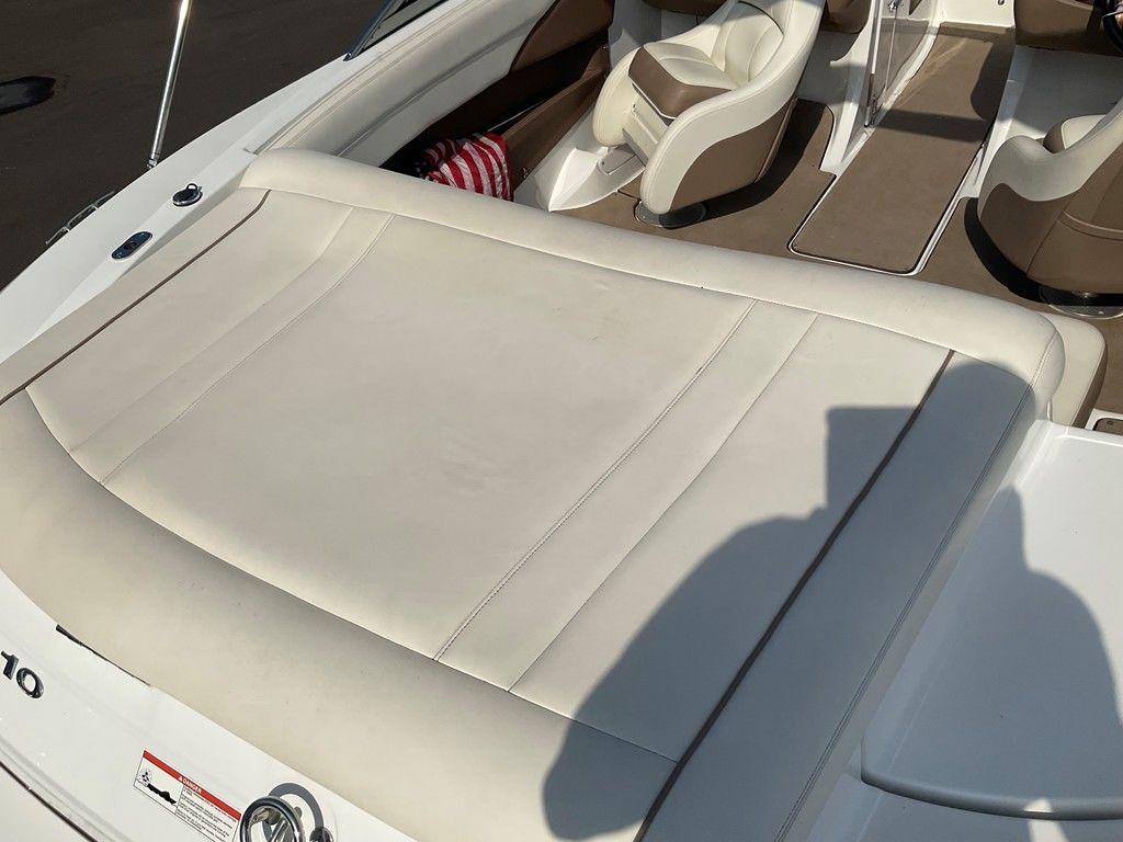 2013 Cobalt 210 boat interior with white leather seating and brown accents.