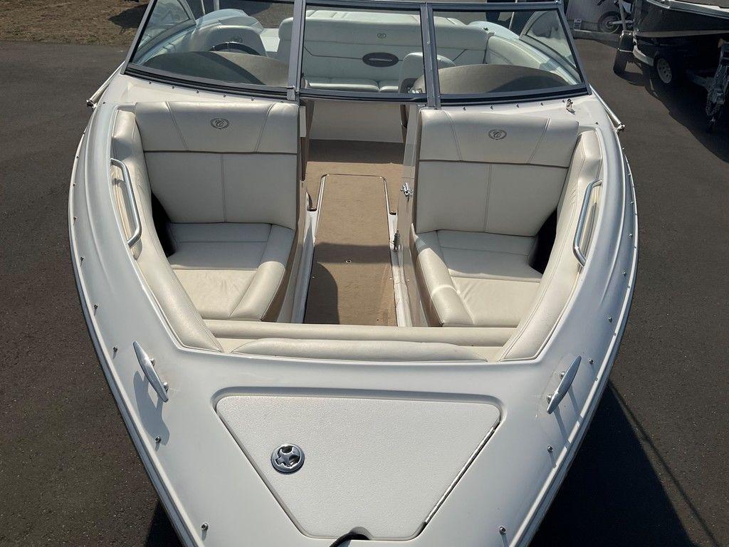 2013 Cobalt 210 boat with white interior and open bow seating.