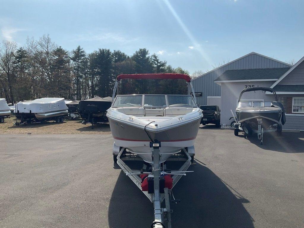 2013 Cobalt 210 boat on trailer in outdoor storage area.
