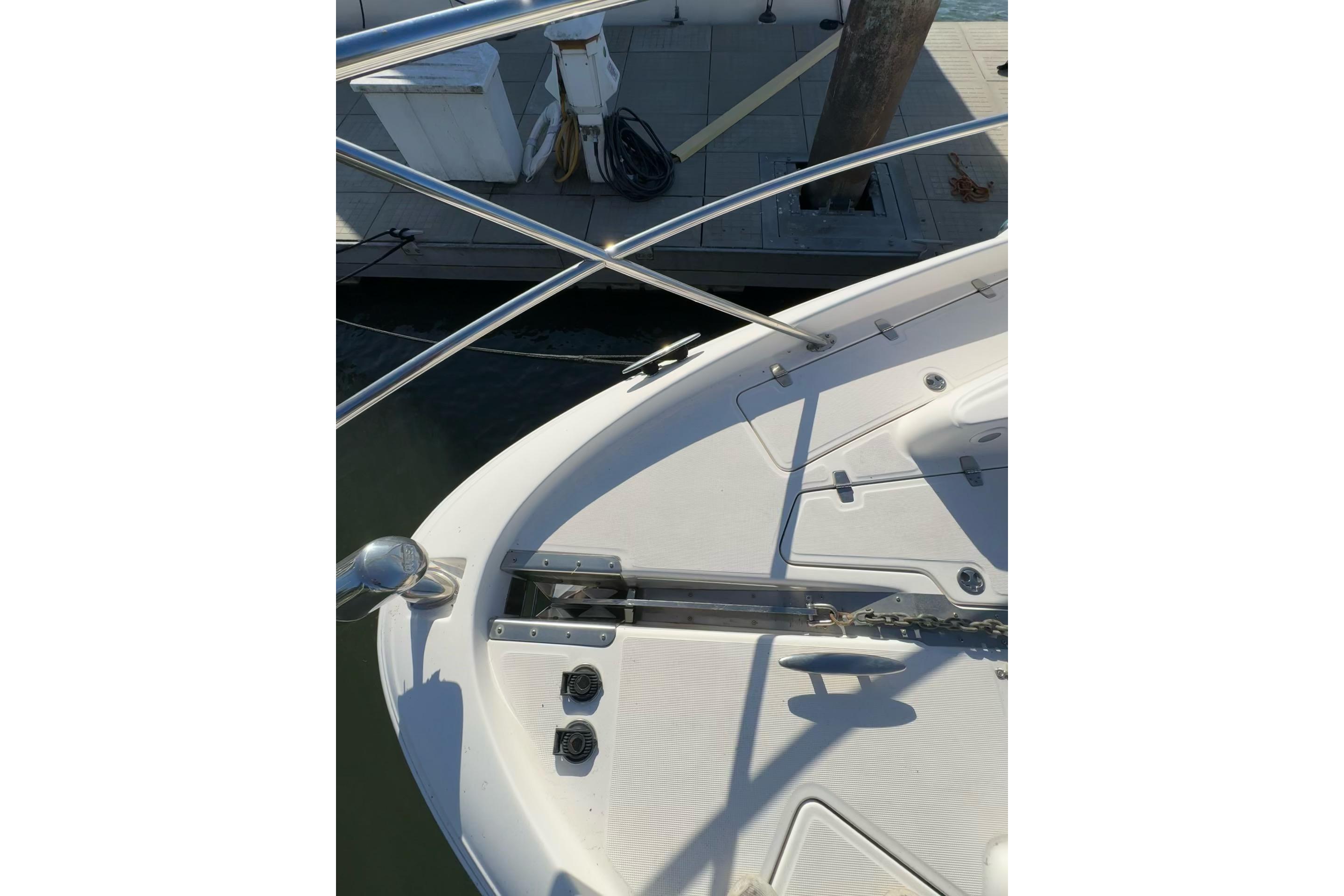 2006 Regal Commodore 4460 boat deck with railing and anchor chain.