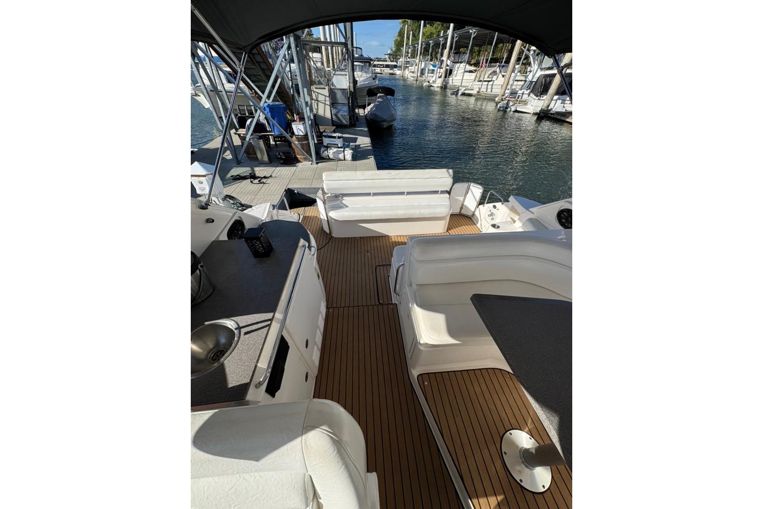 2006 Regal Commodore 4460 yacht interior with seating and marina view.