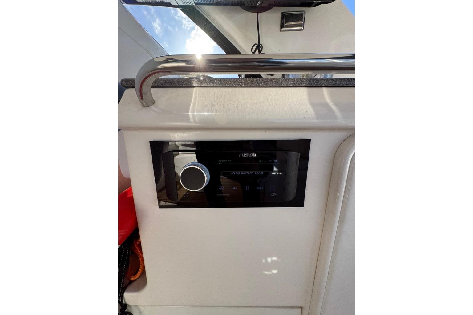 Control panel on 2006 Regal Commodore 4460 boat, featuring a Fusion audio system.