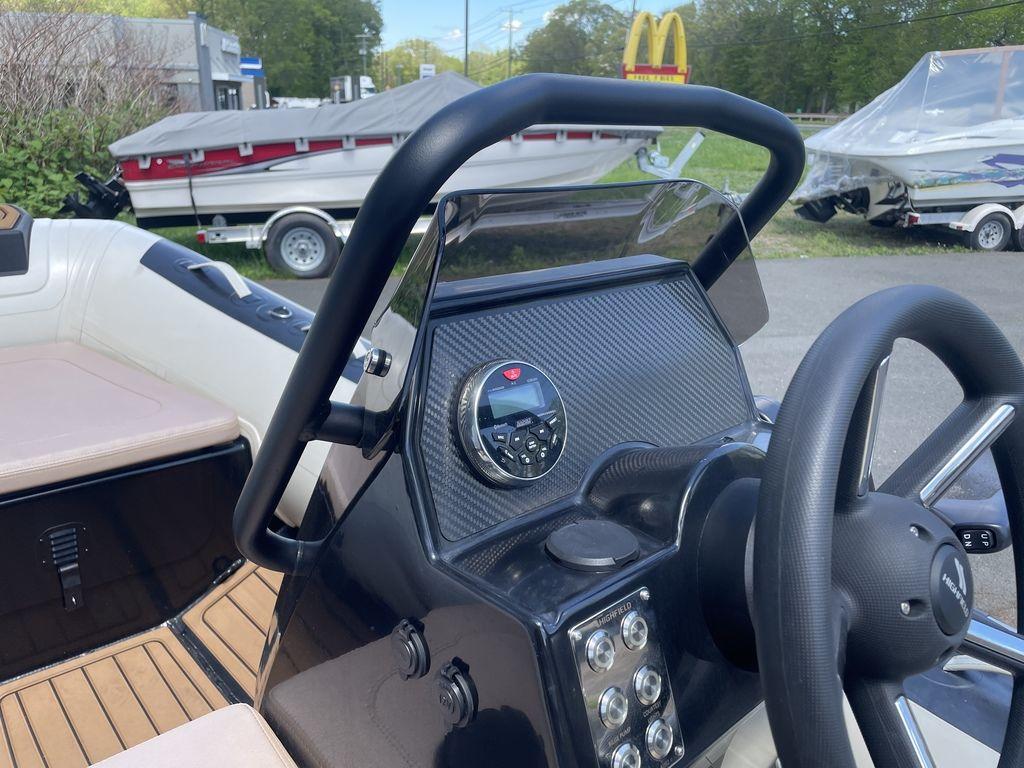2023 Highfield Classic 380 GT Limited boat dashboard with steering wheel and control panel.