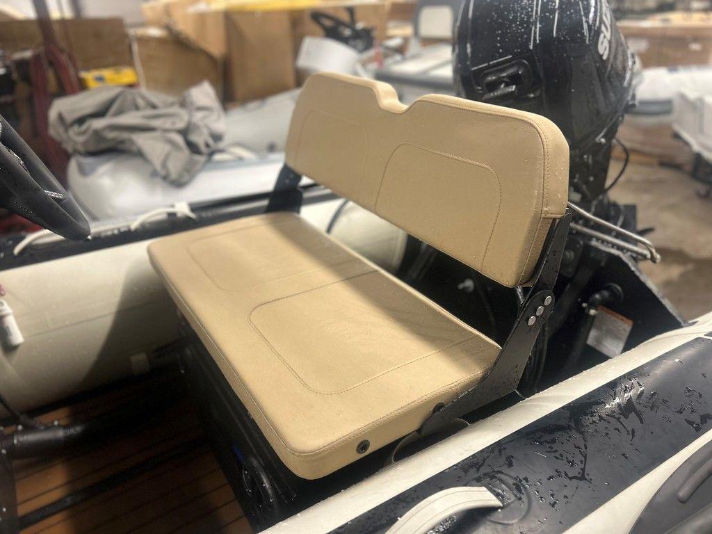 2023 Highfield Classic 380 GT Limited boat seat with beige upholstery.