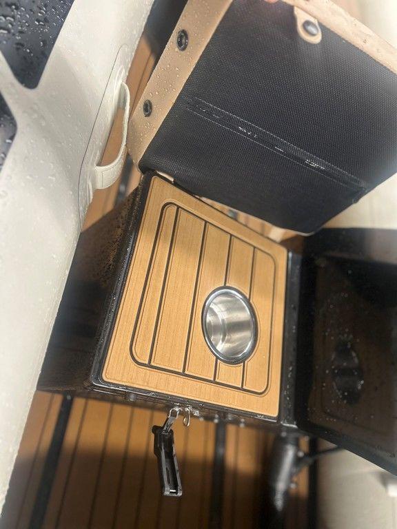 2023 Highfield Classic 380 GT Limited boat interior with wooden panel and cup holder.