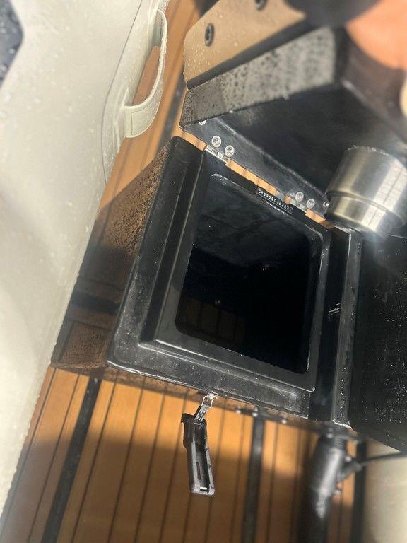 Open compartment on 2023 Highfield Classic 380 GT Limited boat, showing interior details.