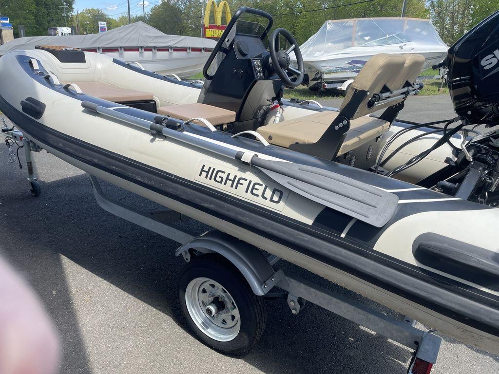 2023 Highfield Classic 380 GT Limited boat on trailer, outdoor display.
