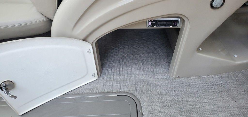 Open storage compartment in 2017 Regency 220 DL3 boat interior.