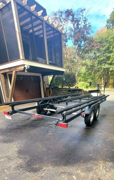 2017 Regency 220 DL3 trailer parked on driveway near a modern house.