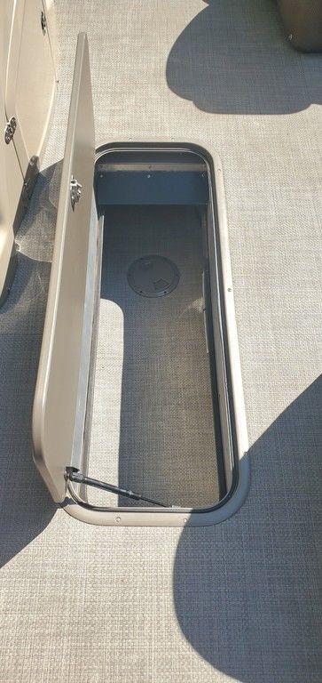 Open storage compartment on 2017 Regency 220 DL3 boat deck.