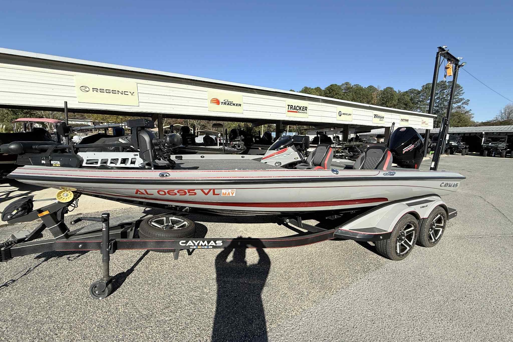 2022 Caymas CX20PRO boat on trailer, parked outdoors, side view.