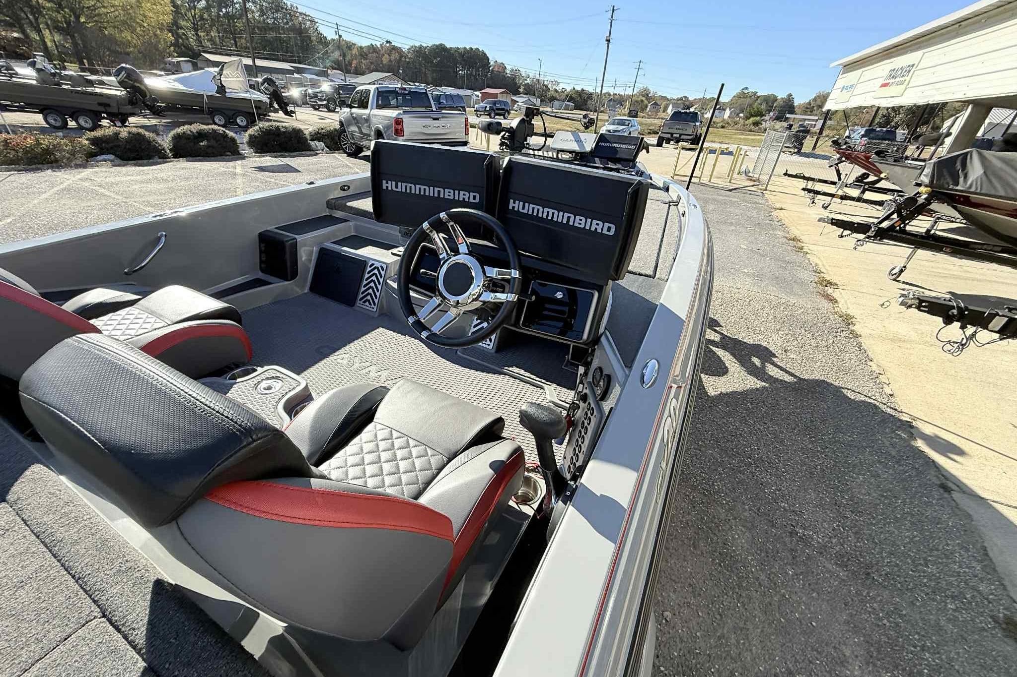 2022 Caymas CX20PRO boat interior with steering wheel and Humminbird electronics.