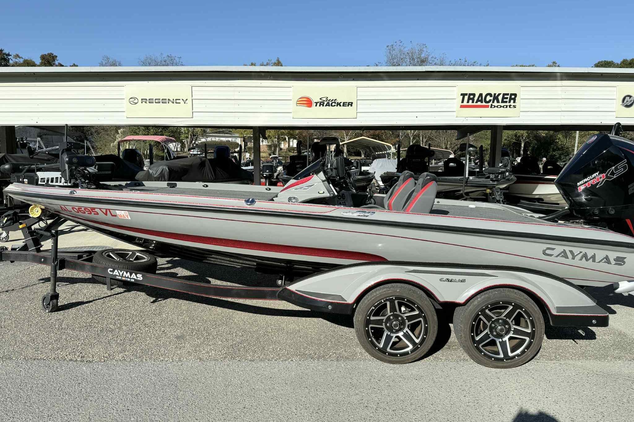 2022 Caymas CX20PRO bass boat on trailer, parked at dealership.