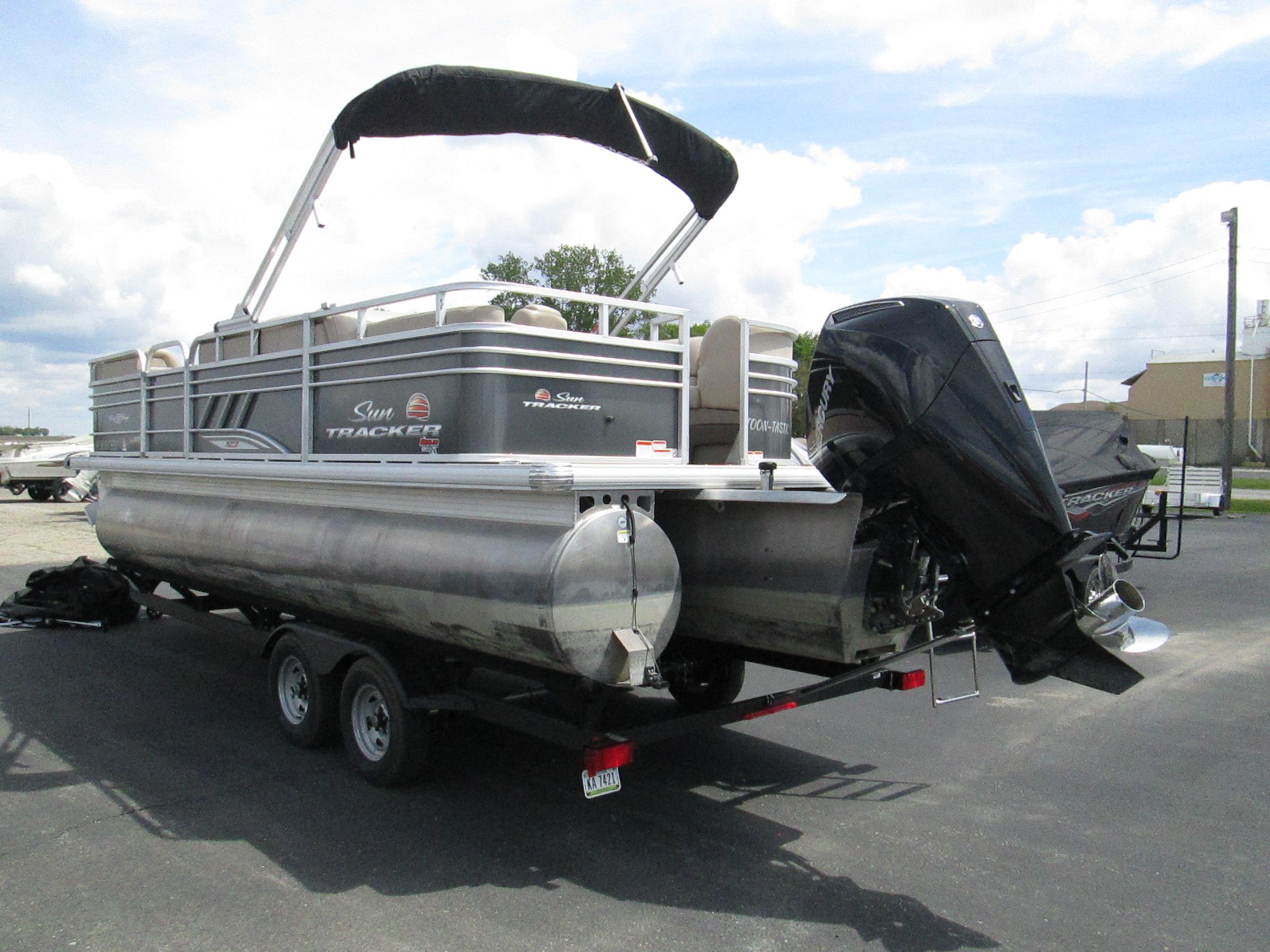 2023 Sun Tracker PARTY BARGE 22RF XP3 pontoon boat on trailer, rear view.