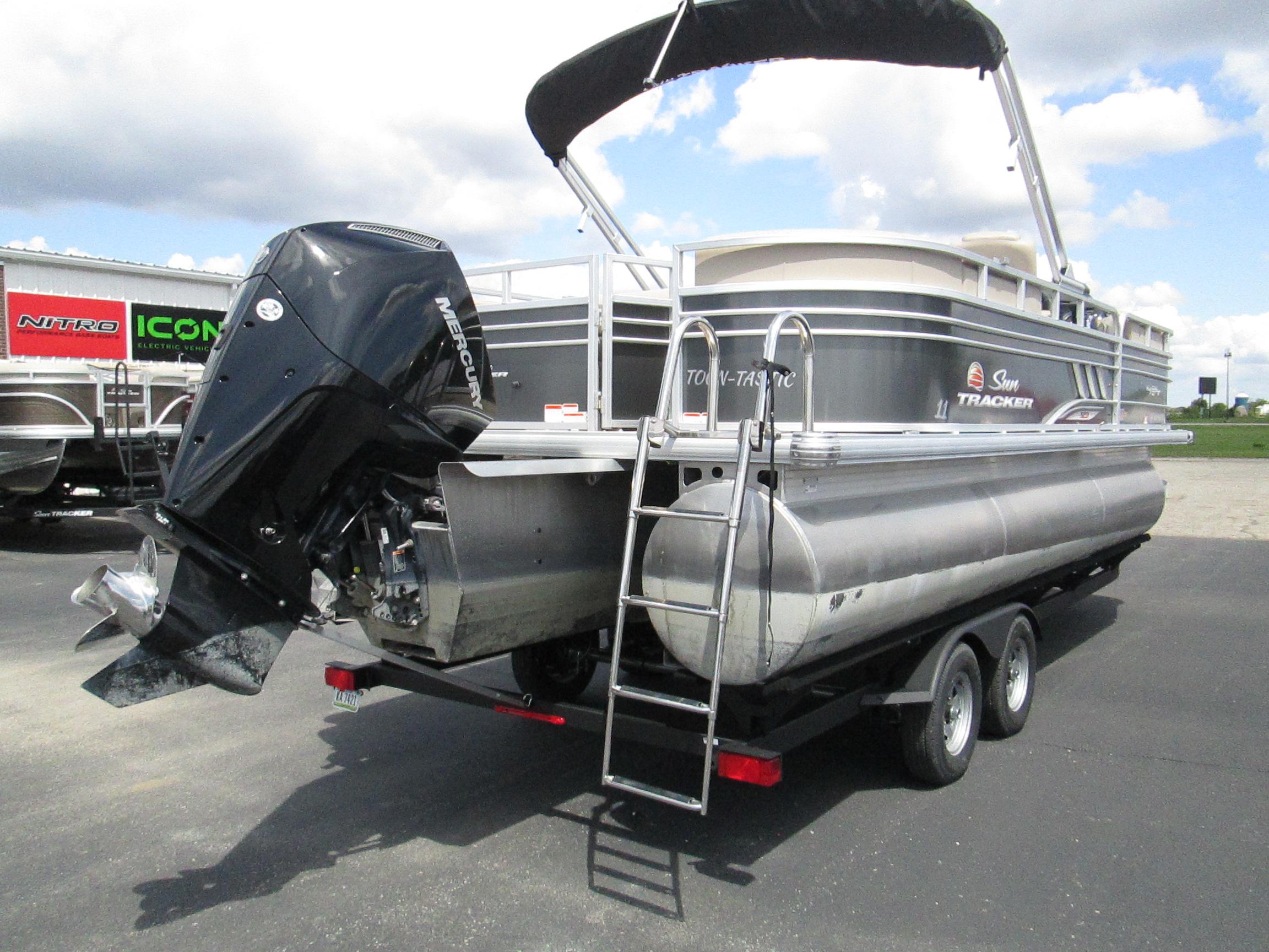 2023 Sun Tracker PARTY BARGE 22RF XP3 pontoon boat with outboard motor and trailer.