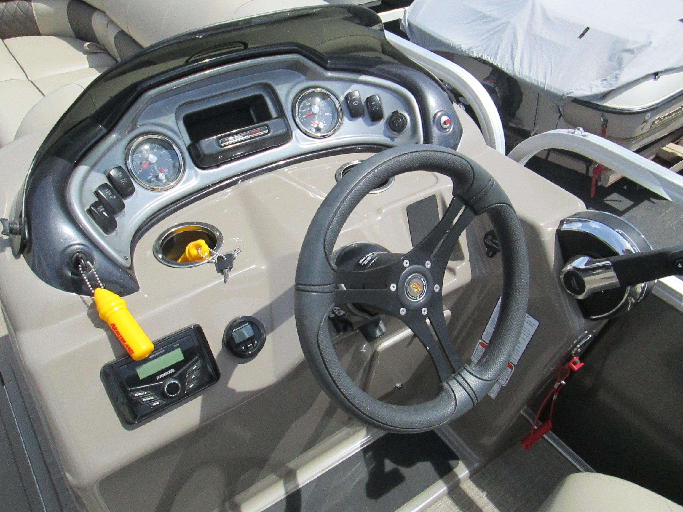 2023 Sun Tracker PARTY BARGE 22RF XP3 dashboard with steering wheel and controls.