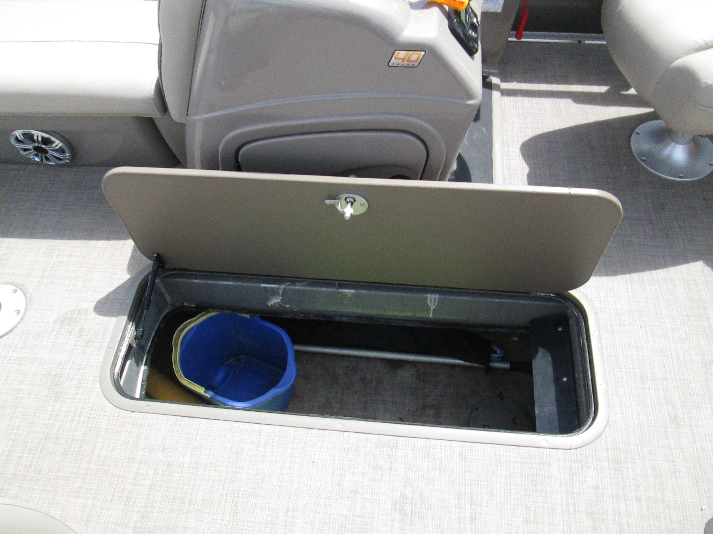 Storage compartment on 2023 Sun Tracker PARTY BARGE 22RF XP3 with bucket inside.